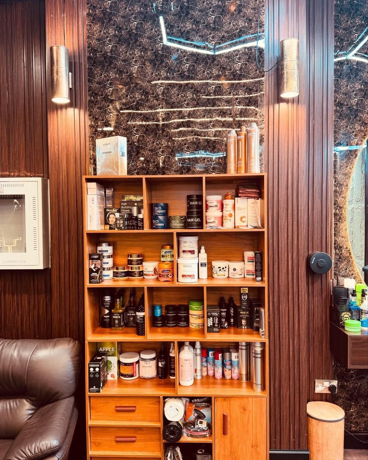 Shelf of pomades, beard oils and aftershaves